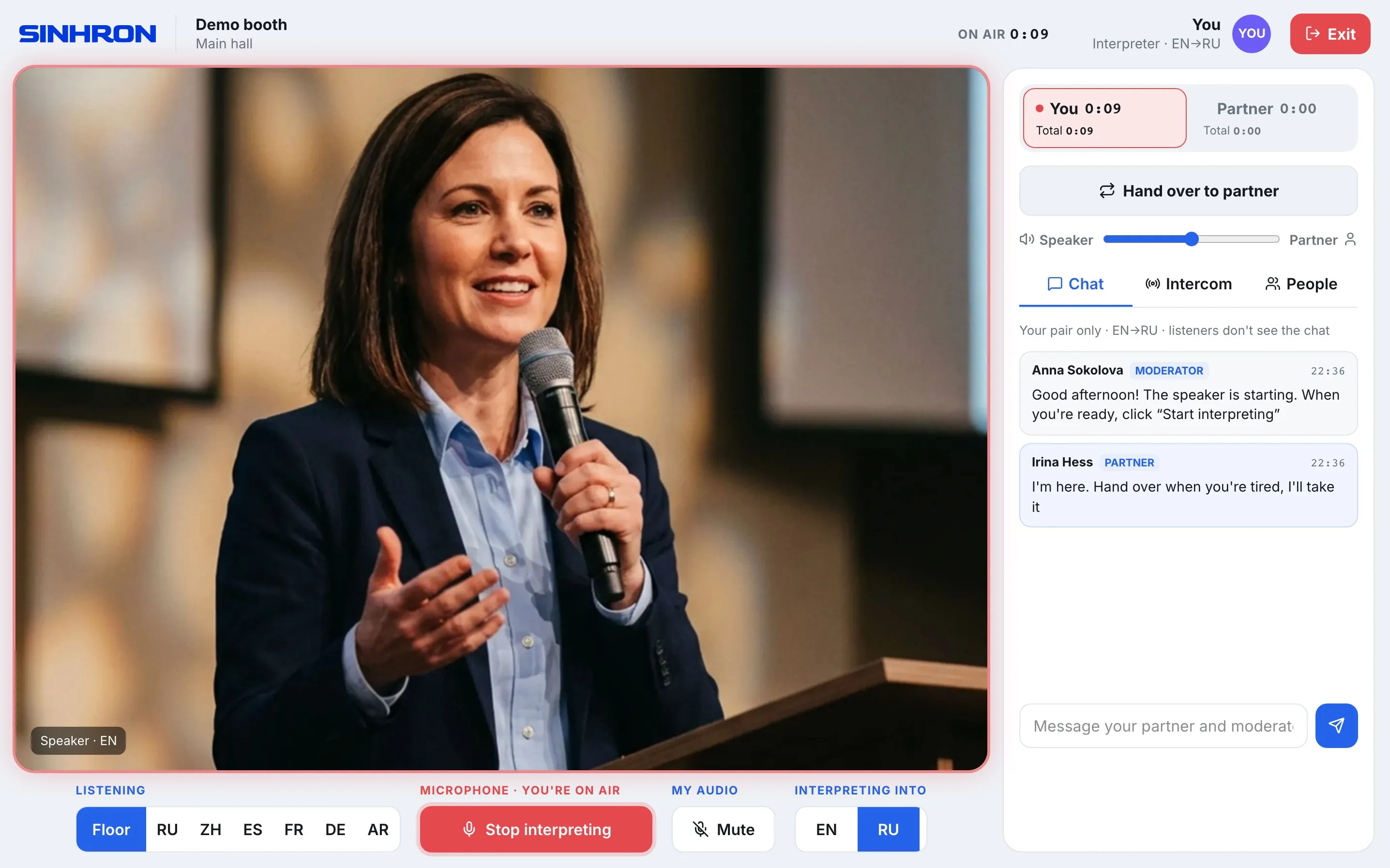 The SINHRON interpreter booth in the browser: language channels, handover, intercom and the speaker video